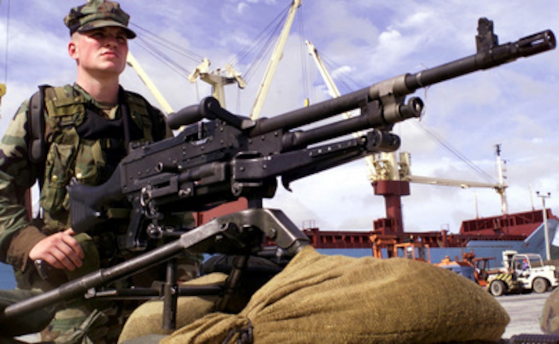 In this April 13, 2000, file photo, a Marine attached to the Fleet Anti-Terrorism Security Team (FAST) keeps watch over the security perimeter entrance at the Royal Thai Navy port in Chuck Sa Met, Thailand, during Exercise Cobra Gold. A U.S. Marine Corps Fleet Anti-Terrorism Security Team (FAST) is deployed to Aden, Yemen, to provide additional security in response to the Oct. 12, 2000, attack on the USS Cole (DDG 67). 
