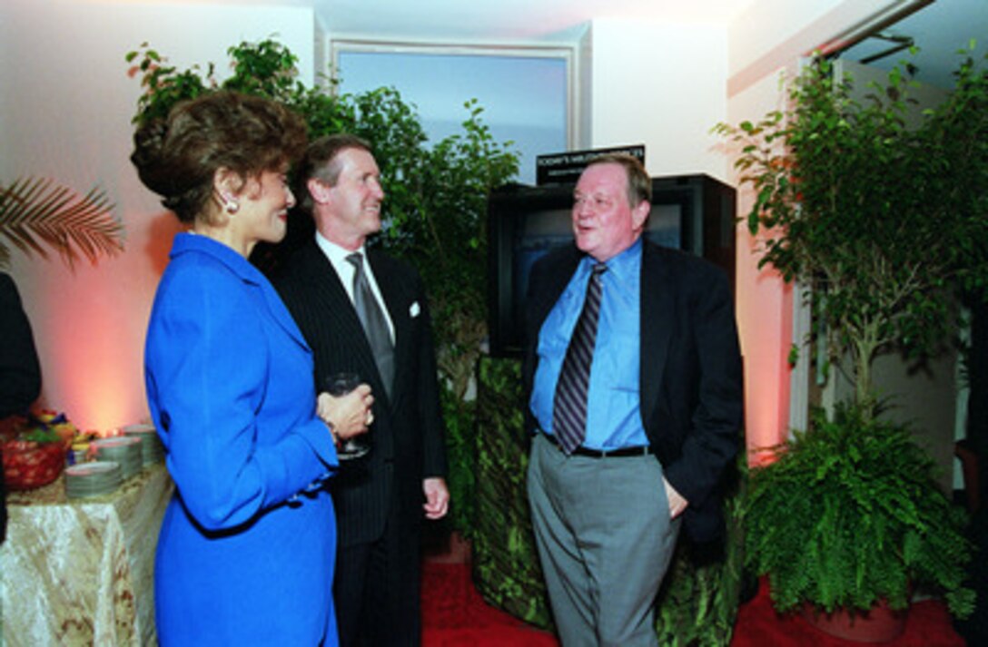 Secretary of Defense and Mrs. William S. Cohen (left) chat with Mr. Richard Schickel (right) during a Pentagon reception and film preview of the Dreamworks film on combat cameramen "Shooting War" on Oct. 4, 2000. Schickel, a Time Magazine film critic, produced the 90-minute documentary about World War II combat photographers. Secretary and Mrs. Cohen invited 250 defense leaders, commanders and corporate executives to the Department of Defense tribute to the military's past and present combat cameramen. 