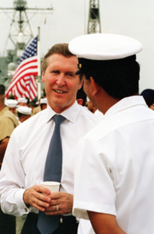 Secretary of Defense William S. Cohen talks to a chief petty officer aboard the USS Germantown (LSD 42) while the ship is in port in the Republic of Singapore on Sept. 17, 2000. Cohen took time out from his Southeast Asia trip to visit with the crew of the dock landing ship. 