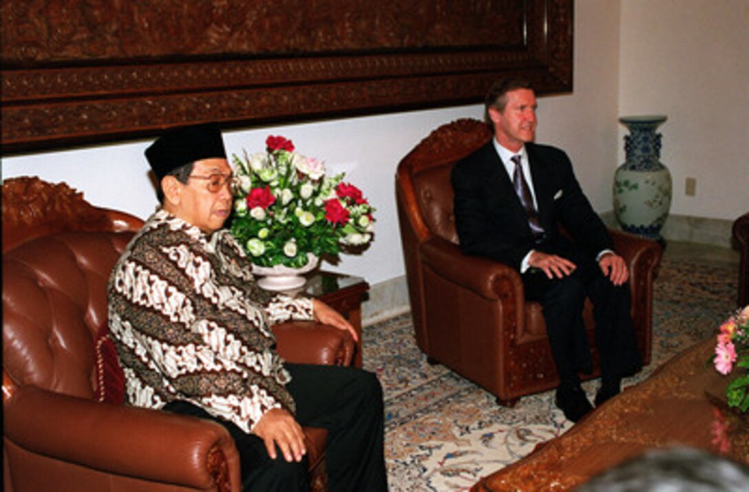 President Abdurrahman Wahid (left) and Secretary of Defense William S. Cohen (right) pose for photographers prior to their meeting at the Presidential Palace in Jakarta, Republic of Indonesia, on Sept. 18, 2000. Cohen is on a Southeast Asia trip to meet with government and defense leaders. 