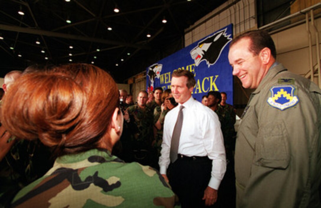 Secretary of Defense William S. Cohen (center) and Col. Philip Breedlove (right), U.S. Air Force, commander, 8th Fighter Wing, talk with airmen at Kunsan Air Base, Republic of Korea on Sept. 21, 2000. Cohen is on a Southeast Asia trip to meet with government and defense leaders. 