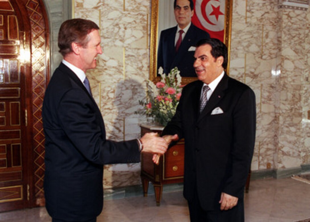 Secretary of Defense William S. Cohen (left) is welcomed by President Zine El Abidine Ben Ali at the Presidential Palace in Tunis, Tunisia, on Oct. 7, 2000. The two men will meet to discuss a broad range of international security issues of interest to both nations. Cohen's stop in Tunisia came at the start of a three nation visit which will also take him to Greece and the United Kingdom. 