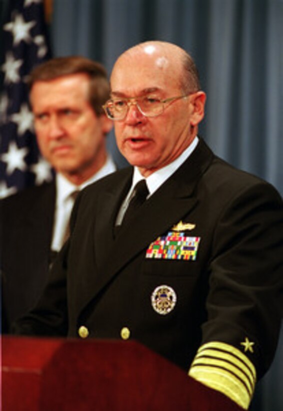 Chief of Naval Operations Adm. Vern Clark (right), U.S. Navy, joins Secretary of Defense William S. Cohen (left) in briefing reporters at the Pentagon about the suspected terrorist attack on the USS Cole (DDG 67) in Aden, Yemen, on Oct. 12, 2000. Cohen reported that five sailors were confirmed dead, 36 wounded and 12 missing, though he believed those figures would change as work in the damaged ship continued. 