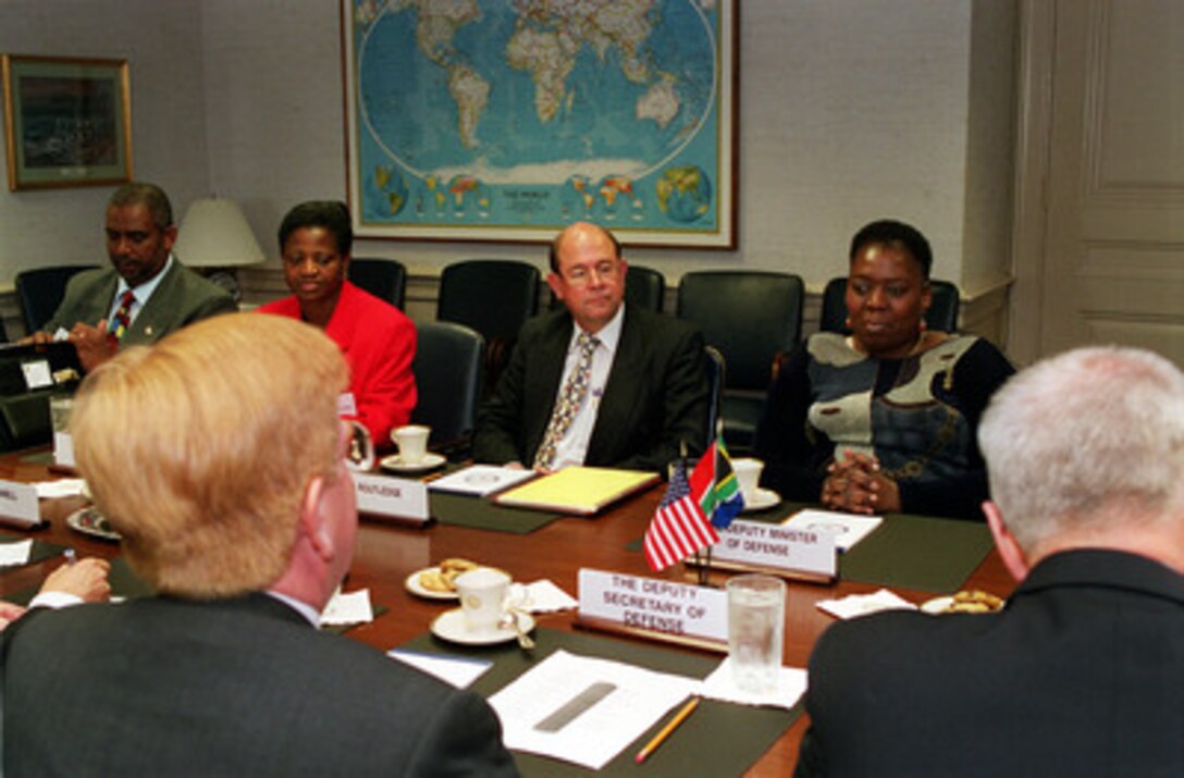 Deputy Secretary of Defense Rudy de Leon (left foreground) meets with South African Deputy Defense Minister Nozizwe Madlala-Routledge (right) in the Pentagon on Oct. 16, 2000. De Leon and Madlala-Routledge are discussing a broad range of security issues of interest to both nations. South African Director of Operations and Policy B. B. Mtimkulu (left), Member of Parliament Zoliswa Kot (2nd from left and Jeremy Routledge participated in the meeting with de Leon and Madlala-Routledge. 