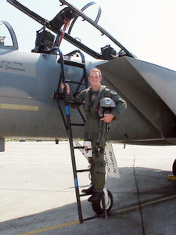 Dale Zimmerman poses for a photograph on the ladder of an F-15 Eagle at Tyndall Air Force Base, Fla., prior to his orientation flight on Aug. 24, 2000. Zimmerman is the Air Force winner of the Yahoo! Fantasy Careers in Today's Military Contest and is spending a two-day adventure as an honorary F-15 pilot. Zimmerman, 22, from Junction City, Ore., is a customer service representative for United Airlines. 