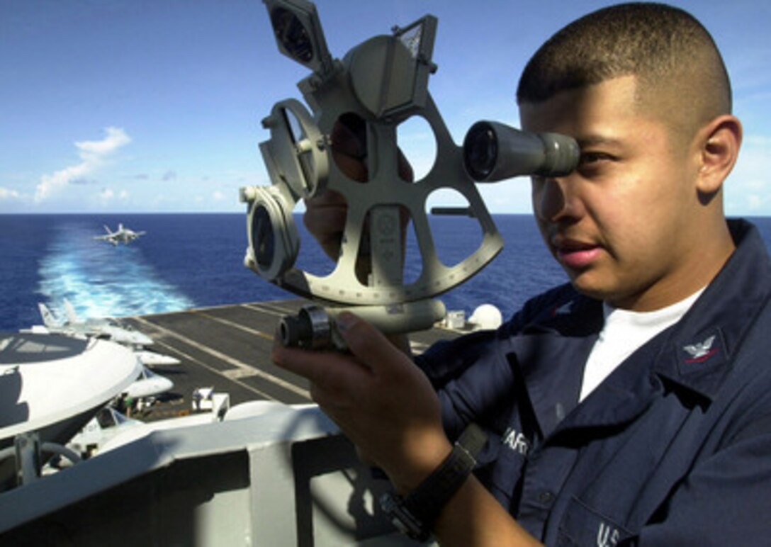 Petty Officer 3rd Class Michael Alvarez uses a sextant to plot the navigational position of the USS Abraham Lincoln (CVN 72) at sea on Sept. 3, 2000. Alvarez, from Los Angeles, Calif., is a Navy quartermaster onboard the aircraft carrier. The Lincoln, its embarked Carrier Air Wing 14 and the Lincoln Battle Group are en route to the Persian Gulf on a routine six-month deployment. 