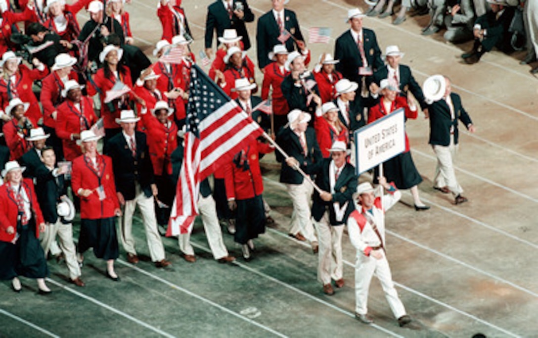 Athletes from the United States of America march into the Olympic Stadium during opening ceremonies for the 2000 Olympic Games in Sydney, Australia, on Sept. 15, 2000. Fifteen U.S. military athletes are competing in the 2000 Olympic games as members of the U.S. Olympic team. In addition to the 15 competing athletes there are eight alternates and five coaches representing each of the four services in various venues. 