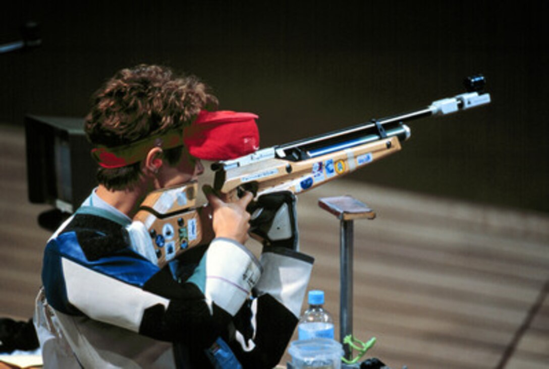 Nancy Johnson aims carefully as she competes in the women's 10 meter air rifle competition at the 2000 Olympic Games in Sydney, Australia, on Sept. 16, 2000. Johnson is married to U.S. Army Staff Sgt. Ken Johnson, who is also on the U.S. Olympic shooting team. 