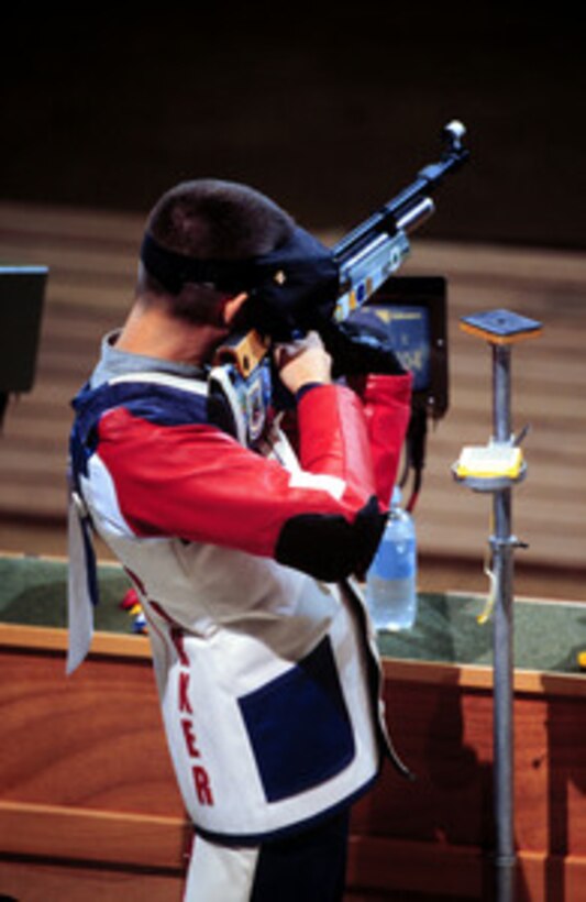 Sgt. Jason A. Parker, U.S. Army, aims down range as he competes in the men's 10 meter air rifle competition at the 2000 Olympic Games in Sydney, Australia, on Sept. 18, 2000. Fifteen U.S. military athletes are competing in the 2000 Olympic games as members of the U.S. Olympic team. In addition to the 15 competing athletes there are eight alternates and five coaches representing each of the four services in various venues. Parker is attached to the U.S. Army Marksmanship Unit, Fort Benning, Ga. 