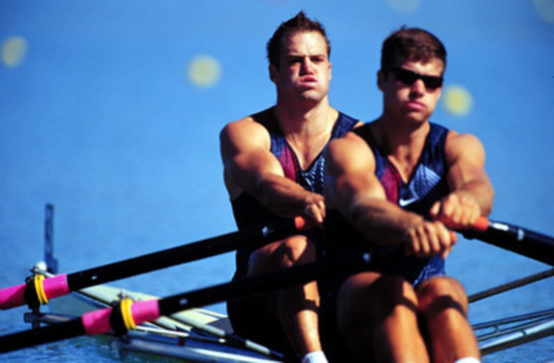 Ensign Henry Nuzum (left) and Mike Ferry stroke their way toward a second place finish during the semi-finals, or repechage, of the men's double sculls round at the 2000 Olympic Games in Sydney, Australia, on Sept. 19, 2000. Nuzum is one of 15 U.S. military athletes are competing in the 2000 Olympic games as members of the U.S. Olympic team. In addition to the 15 competing athletes there are eight alternates and five coaches representing each of the four services in various venues. Nuzum and Ferry will advance to the next round of on Thursday, Sept. 21. 
