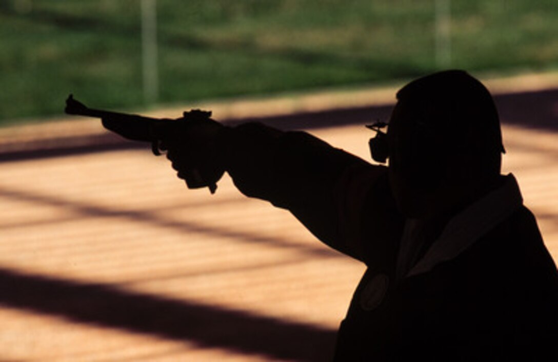 Army Sgt. 1st Class Daryl L. Szarenski shoots during the 50 meter air pistol competition at the 2000 Olympic Games in Sydney, Australia, on Sept. 19, 2000. Fifteen U.S. military athletes are competing in the 2000 Olympic games as members of the U.S. Olympic team. In addition to the 15 competing athletes there are eight alternates and five coaches representing each of the four services in various venues. Szarenski is attached to the U.S. Army Marksmanship Unit, Fort Benning, Ga. 