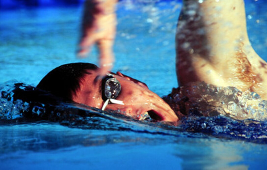 U.S. Army Spc. Chad Senior hits the pool as he trains on Sept. 22, 2000, for the modern pentathlon event at the 2000 Olympic Games in Sydney, Australia. The modern pentathlon consists of 10 meter air pistol shooting, fencing, 200 meter freestyle swimming, equestrian show jumping and a 3,000 meter run. Senior is one of fifteen U.S. military athletes competing in the 2000 Olympic games as members of the U.S. Olympic team. In addition to the 15 competing athletes there are eight alternates and five coaches representing each of the four services in various venues. 