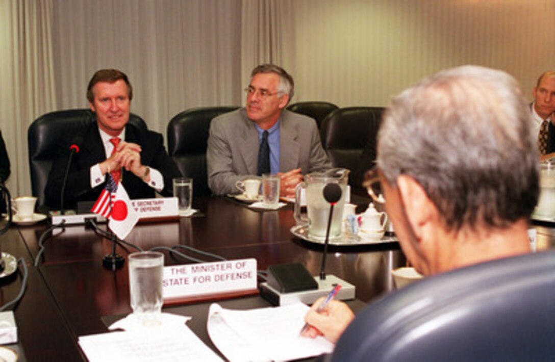 Secretary of Defense William S. Cohen (left) and Secretary of the Navy Richard Danzig (center) meet with Director General of the Japan Defense Agency Kazuo Torashima (foreground) at the Pentagon on Sept. 12, 2000. The three defense leaders are discussing a range of regional security issues interest to both nations. 