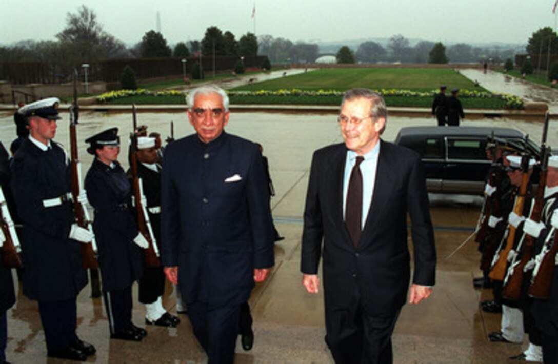 Secretary of Defense Donald H. Rumsfeld (right) escorts Minister of Defense Jaswant Singh, of India, through an honor cordon and into the Pentagon on April 6, 2001. The two defense leaders will meet to discuss a range of regional and global security issues of interest to both nations. 
