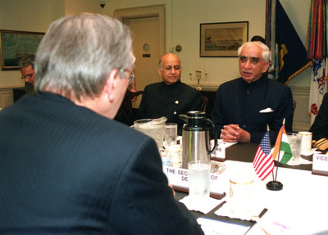 Indian Minister of Defense Jaswant Singh (right), meets with Secretary of Defense Donald H. Rumsfeld (foreground) in the Pentagon, on April 6, 2001. The two defense leaders are meeting to discuss a range of regional and global security issues of interest to both nations. India's Ambassador to the United States Lalit Mansingh (center) joined Singh and Rumsfeld in the talks. 