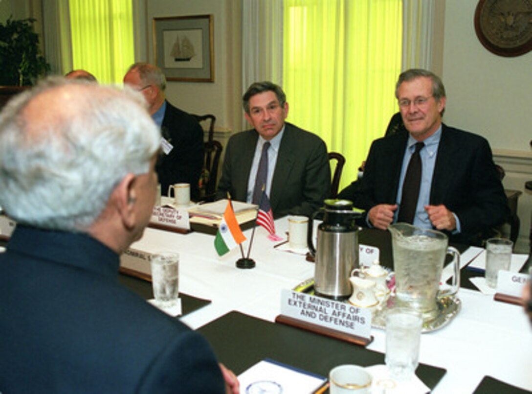 Secretary of Defense Donald H. Rumsfeld (right) and Deputy Secretary of Defense Paul Wolfowitz (center) meet with Indian Minister of Defense Jaswant Singh in the Pentagon on April 6, 2001. The defense leaders are meeting to discuss a range of regional and global security issues of interest to both nations. 