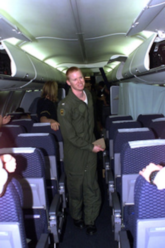 Navy Lt. j.g. Jeffery Vignery is the first to board a chartered aircraft that will fly him from Haikou, China, to Guam, on April 12, 2001, during Operation Valiant Return. Vignery is one of 24 crew members detained for 11 days after their EP-3 Aries II reconnaissance aircraft made forced landing on Hainan Island as a result of a collision with a Chinese F-8 fighter aircraft. The crew will stop briefly in Guam to change planes and will then continue on to Hawaii for military debriefings before a final reunion with families and friends on the mainland. Vignery is from Goodland, Kan. 