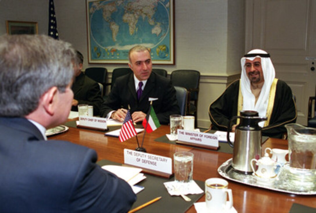 Kuwait Minister of State for Foreign Affairs Sheik Mohammed Sabah al-Salim al-Sabah (right) meets with Deputy Secretary of Defense Paul Wolfowitz (left) in the Pentagon on April 17, 2001. Sheik Mohammed is meeting with Wolfowitz to discuss a range of regional policy and security issues of interest to both nations. Ahmad Bader Mahmood Razouqi (center), the deputy chief of mission at the Embassy of Kuwait, in Washington, D. C., joined in the talks. 