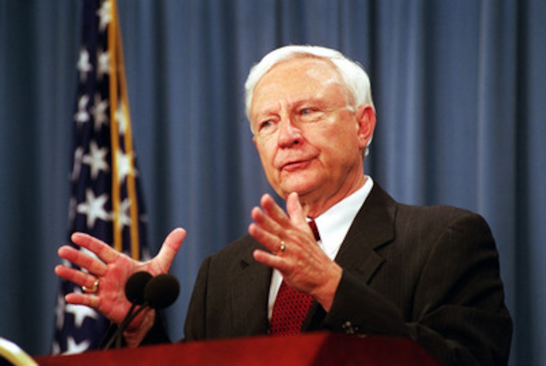 Under Secretary of Defense for Acquisition, Technology, and Logistics Pete Aldridge briefs reporters on the Department of Defense proposed legislation for an additional round of base closures during a Pentagon press briefing on Aug. 2, 2001. 