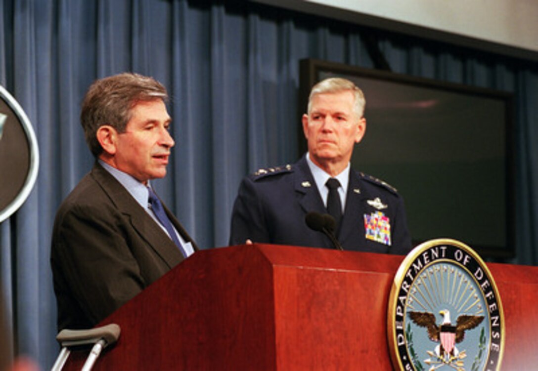 Deputy Secretary of Defense Paul Wolfowitz and Vice Chairman of the Joint Chiefs of Staff Gen. Richard B. Meyers, U.S. Air Force, provide a update briefing on the progress of the Quadrennial Defense Review to reporters in the Pentagon on Aug. 8, 2001. 