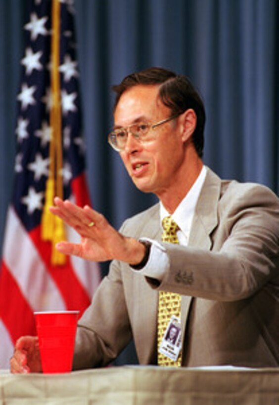 Under Secretary of Defense for Personnel and Readiness David Chu responds to a reporter's question during a media roundtable at the Pentagon on Aug. 8, 2001. Chu discussed a broad range of issues including his views on gender integrated training, length and frequency of deployments, length of permanent change of duty station tours, and the length of military careers. 