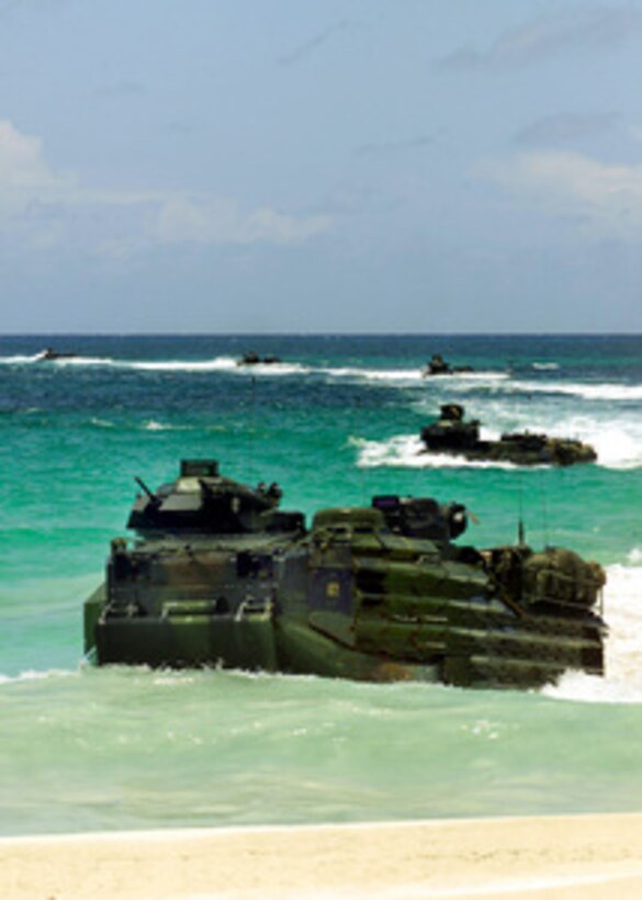 U.S. Marine Corps Armored Amphibious Vehicles emerge from the surf to land at Blue Beach on the island of Vieques, Puerto Rico, on Aug. 6, 2001. The Marines, deployed from Camp Lejeune, N.C. , are participating in a Supporting Arms Coordination exercise designed to provide advanced-level training for Marine forces. 