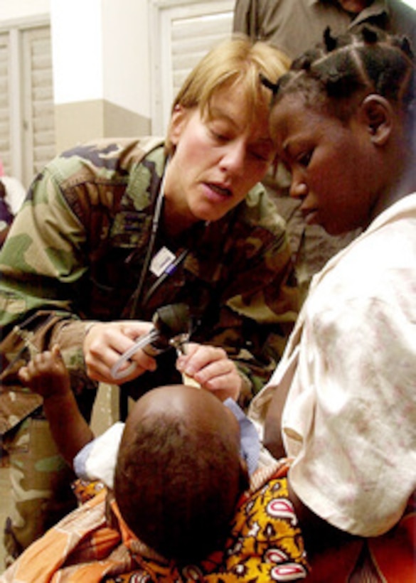 Capt. Lee Ranstrom, an Air Force pediatrician, gives a physical exam to an infant during the MedFlag 01-02 Exercise in Nampula, Mozambique, on July 27, 2001. MedFlag is an annual United States European Command medical training exercise conducted in different countries around the world. Ranstrom is attached to the 48th Fighter Wing, Royal Air Force Lakenheath, United Kingdom. 