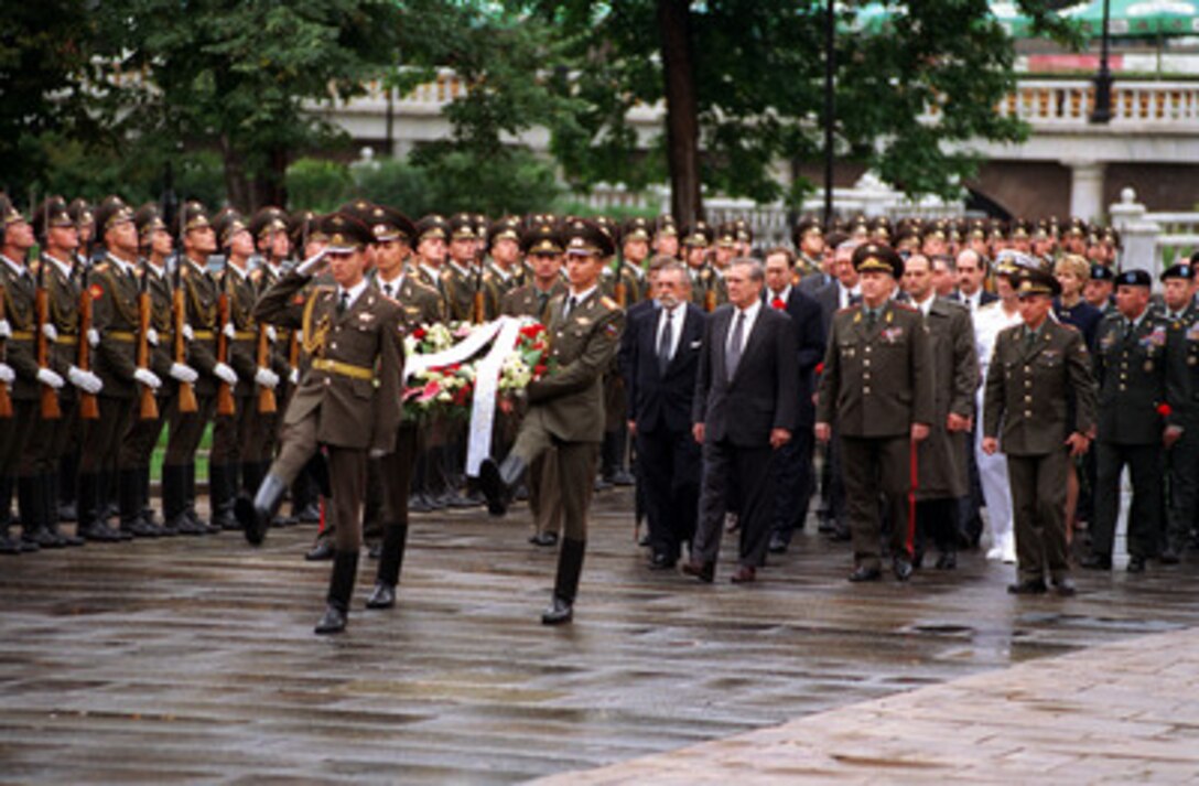 Secretary of Defense Donald H. Rumsfeld leads a wreath laying procession at the Tomb of the Unknown outside the Kremlin wall in Moscow on Aug. 13, 2001. Rumsfeld is in Russia to meet with defense leaders and discuss the Anti-Ballistic Missile Treaty. 