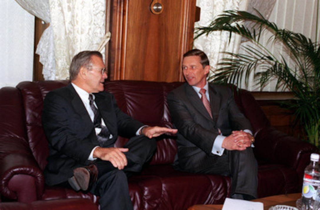 Secretary of Defense Donald H. Rumsfeld (left) talks with Minister of Defense Sergey Borisovich Ivanov during their meeting at the Ministry of Defense Headquarters in Moscow, Russia, on Aug. 13, 2001. Rumsfeld is in Russia to meet with defense leaders and discuss the Anti-Ballistic Missile Treaty. 