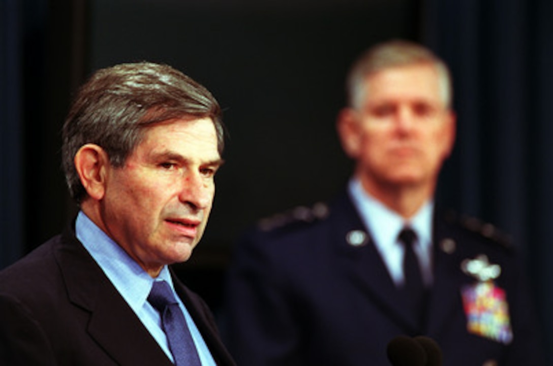 Deputy Secretary of Defense Paul Wolfowitz (left) responds to a reporter's question during his Pentagon press briefing on Defense Planning Guidance on Aug. 16, 2001. Vice Chairman of the Joint Chiefs of Staff Gen. Richard B. Myers joined Wolfowitz during the briefing. 
