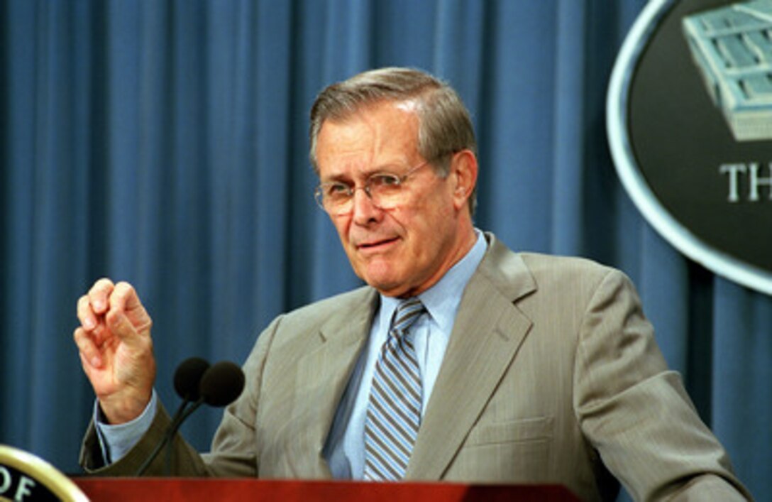 Secretary of Defense Donald H. Rumsfeld talks to reporters during a Pentagon press briefing on Aug. 23, 2001. 