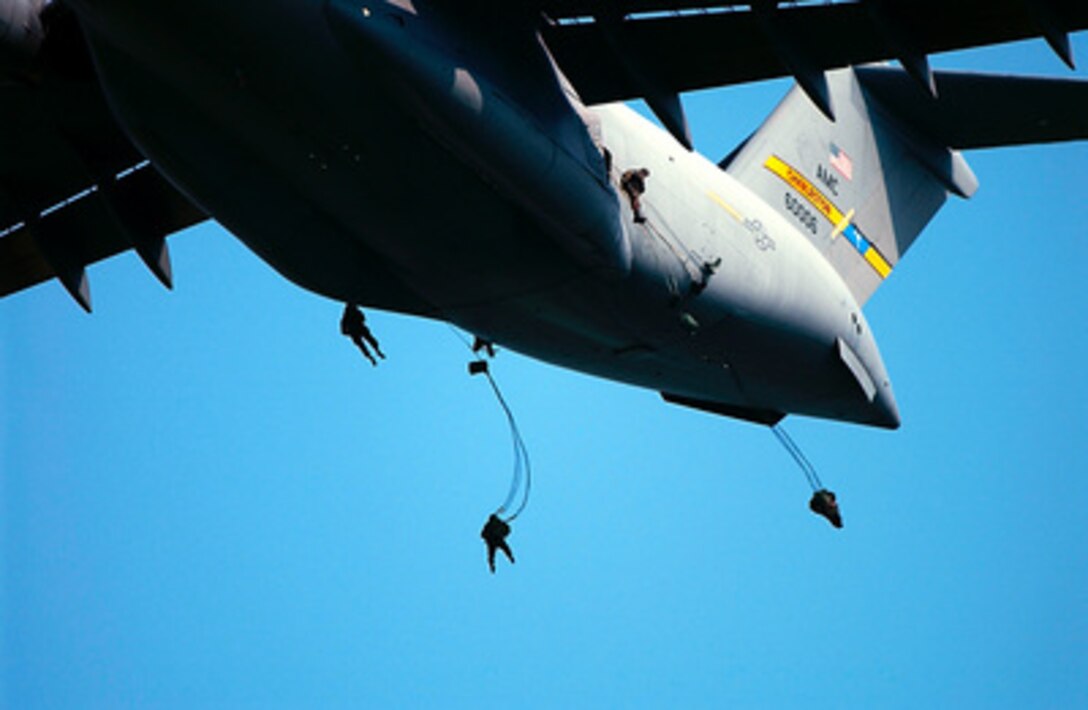 Soldiers of the Army's 82nd Airborne Division jump from an Air Force C-17 Globemaster III over Charleston Air Force Base, S.C., on Aug. 9, 2001. Three hundred soldiers from Fort Bragg, N.C., participated in the training jump. 
