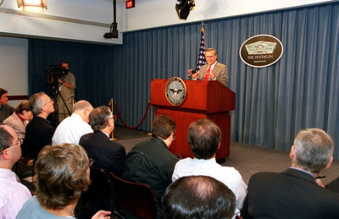 Secretary of Defense Donald H. Rumsfeld briefs reporters during a media availability in the Pentagon on Aug. 17, 2001. 