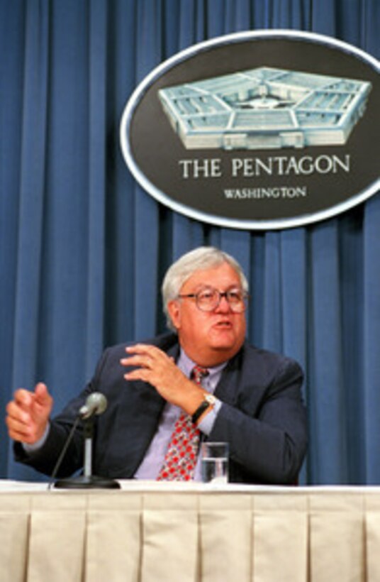 Assistant Secretary of Defense (Command, Control, Communications and Intelligence) John P. Stenbit answers reporters' questions during a media roundtable in the Pentagon on Aug. 24, 2001. 