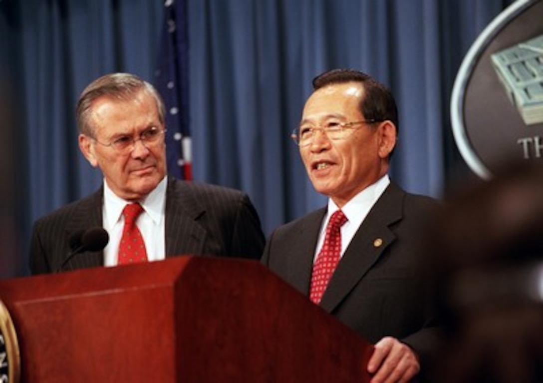 South Korean Minister of National Defense Kim Dong Shin (right) responds to a reporter's question during a joint press conference with Secretary of Defense Donald H. Rumsfeld (left) in the Pentagon on Nov. 15, 2001. The press conference was held in conjunction with the annual, day-long, U.S.--Republic of Korea Security Consultative Meeting which provides an opportunity for the two nations to review their security relationships and propose modifications, as necessary, to deal with changing world conditions. 