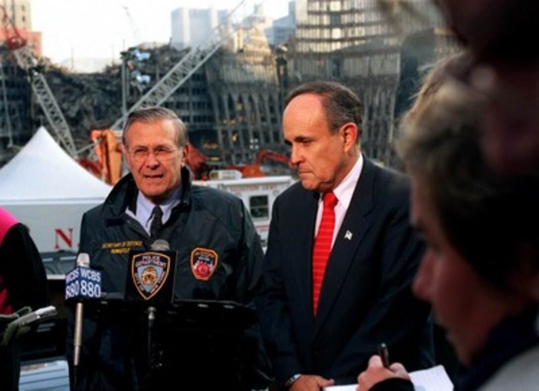 Secretary of Defense Donald H. Rumsfeld (left) and New York Mayor Rudolph Giuliani (right) hold a joint media availability at the site of the World Trade Center disaster in lower Manhattan, on Nov. 14, 2001. Rumsfeld is visiting the site of the Sept. 11th disaster to speak to Giuliani, officials from the N.Y. Fire Department and the Office of Emergency Management. 
