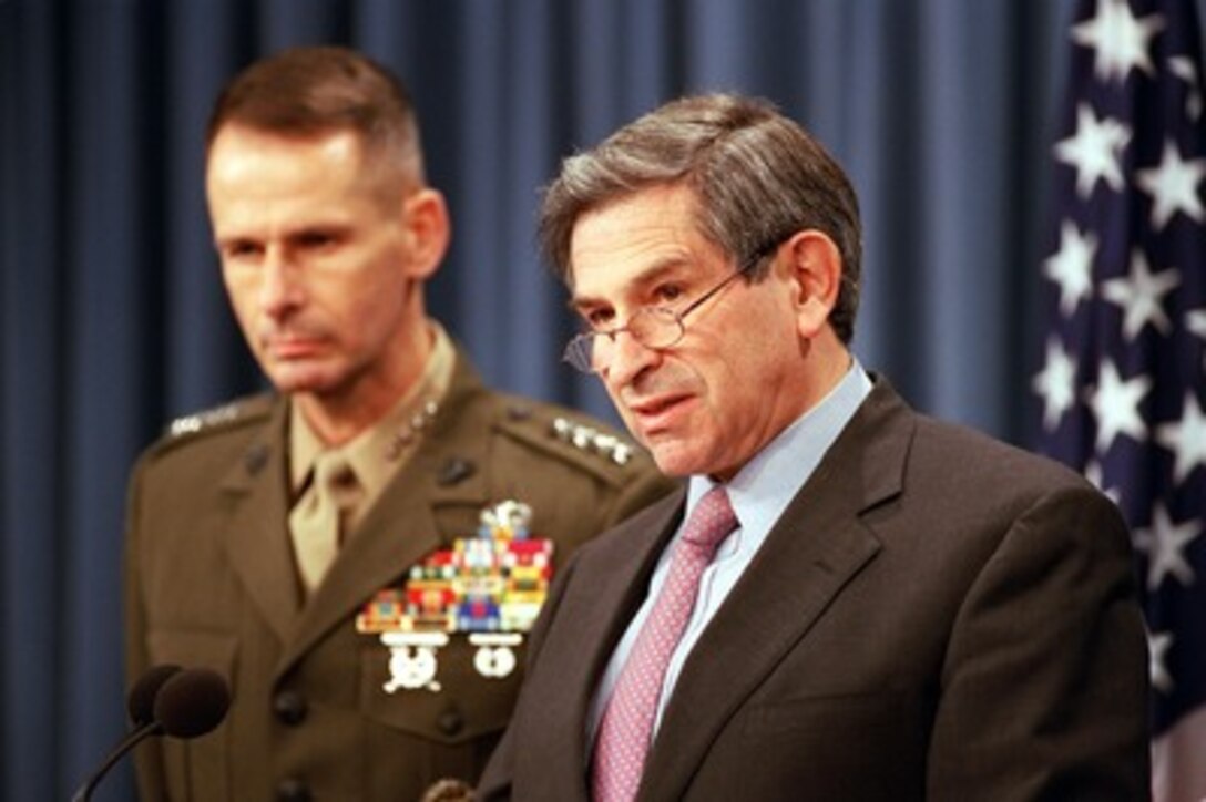 Deputy Secretary of Defense Paul Wolfowitz (right) is joined by Vice Chairman of the Joint Chiefs of Staff Gen. Peter Pace in briefing reporters at the Pentagon on Nov. 21, 2001. Wolfowitz and Pace briefed on the progress of the on-going campaign against the al Qaeda terrorist organization and the military capability of Taliban regime in Afghanistan. 