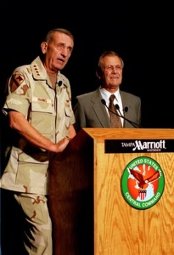 Commander-in-Chief, U.S. Central Command Gen. Tommy R. Franks, U.S. Army, and Secretary of Defense Donald H. Rumsfeld brief reporters on military operations in Afghanistan at the Marriott Waterside Hotel in Tampa, Fla., on Nov. 27, 2001. Rumsfeld will later tour Central Command Headquarters and McDill Air Force Base to meet with some of the U.S. and international military personnel managing the various aspects of the ongoing military operations in and around Afghanistan. 