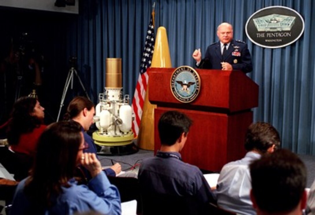 Air Force Lt. Gen. Ronald T. Kadish briefs reporters at the Pentagon on Nov. 30, 2001, about the upcoming Ballistic Missile Defense Organization's Integrated Flight Test 7. The test will involve the launch of a long-range ballistic missile from Vandenberg Air Force Base, Calif., followed about 20 minutes later by the launch of a missile carrying the prototype exoatmospheric kill vehicle from the Kwajalein Atoll. Kadish is the director of the Ballistic Missile Defense Organization. 