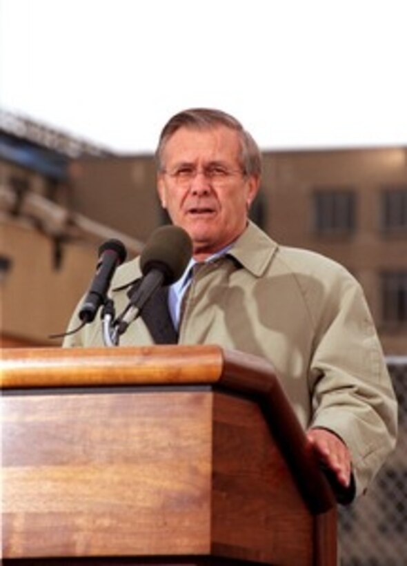 Secretary of Defense Donald H. Rumsfeld addresses the audience during a Dec. 11, 2001, Pentagon ceremony in remembrance of those who perished in the terrorist attack on Sept. 11. The ceremony began with the presentation of the colors and the playing of the National Anthem at 9:38 a.m., the precise time American Airlines Flight 77 impacted the southwest face of the building killing 184 people. The ceremony is part of a day of remembrance proclaimed by President George W. Bush. 
