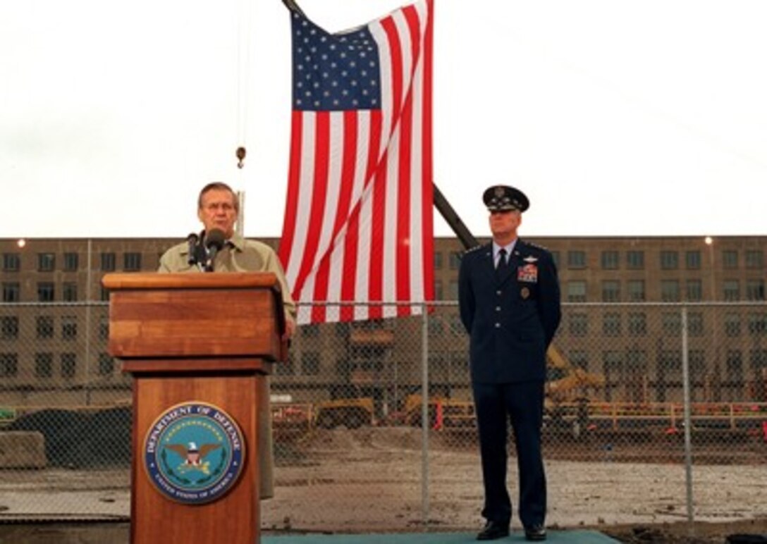 Secretary of Defense Donald H. Rumsfeld addresses the audience during a Dec. 11, 2001, Pentagon ceremony in remembrance of those who perished in the terrorist attack on Sept. 11th. The ceremony began with the presentation of the colors and the playing of the National Anthem at 9:38 a.m., the precise time American Airlines Flight 77 impacted the southwest face of the building killing 184 people. The ceremony is part of a day of remembrance proclaimed by President George W. Bush. Chairman of the Joint Chiefs of Staff Gen. Richard B. Myers, U.S. Air Force joined Rumsfeld in the remembrance ceremony. 