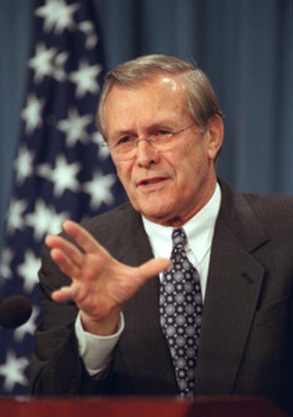 Defense Secretary Donald H. Rumsfeld briefs reporters at the Pentagon on December 19, 2001, about some of the highlights of his just completed overseas trip, which included a stop in Afghanistan. 