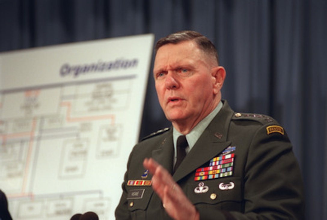 Gen. John Keane, U.S. Army, vice chief of staff, briefs Pentagon reporters on some of the proposed changes to the headquarters organization of the U.S. Army. The Dec. 18, 2001, briefing highlighted the efforts by both the Army and Air Force to comply with the management imperatives laid down in a speech made by Secretary of Defense Donald Rumsfeld on the day before the Sept. 11 terrorist attacks against the United States. 