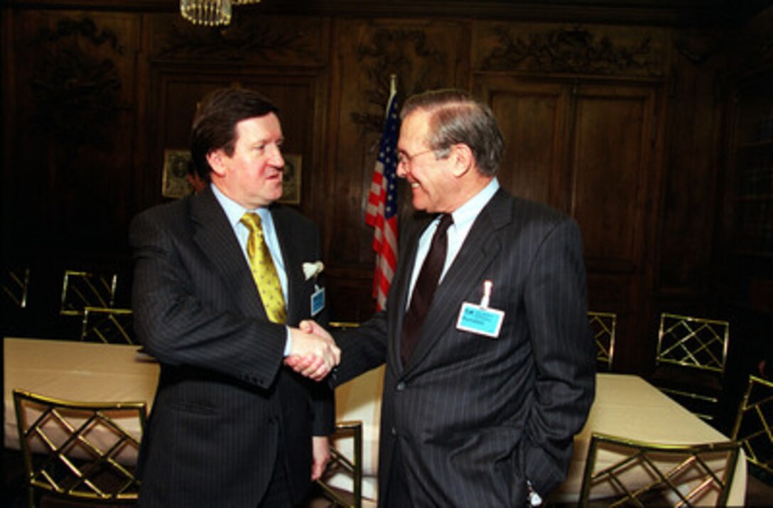 Secretary of Defense Donald H. Rumsfeld (right) meets with NATO Secretary General Lord George Robertson at a bilateral meeting in Munich, Germany, on Feb. 3, 2001. Rumsfeld and Robertson are attending the 37th Munich Conference on Security Policy. 