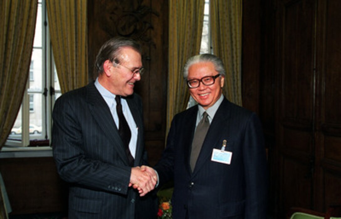 Secretary of Defense Donald H. Rumsfeld (left) greets Deputy Prime Minister and Minister of Defense Tony Tan, of the Republic of Singapore, at the 37th Munich Conference on Security Policy Feb. 3, 2001. 