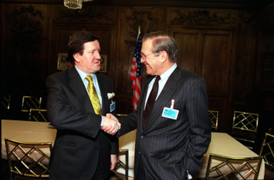 Secretary of Defense Donald H. Rumsfeld (right) meets with NATO Secretary General Lord George Robertson at a bilateral meeting in Munich, Germany, on Feb. 3, 2001. Rumsfeld and Robertson are attending the 37th Munich Conference on Security Policy. 