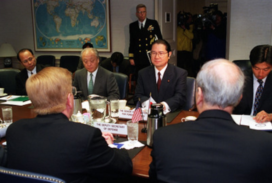 Japanese Senior Vice Minister of Foreign Affairs Seishiro Eto (right) and Ambassador to the U.S. Shunji Yanai (left) meet in the Pentagon with Deputy Secretary of Defense Rudy de Leon (left foreground) on Feb. 16, 2001, to discuss the February 9th collision of the submarine USS Greeneville and the Japanese fishing vessel Ehime Maru. 