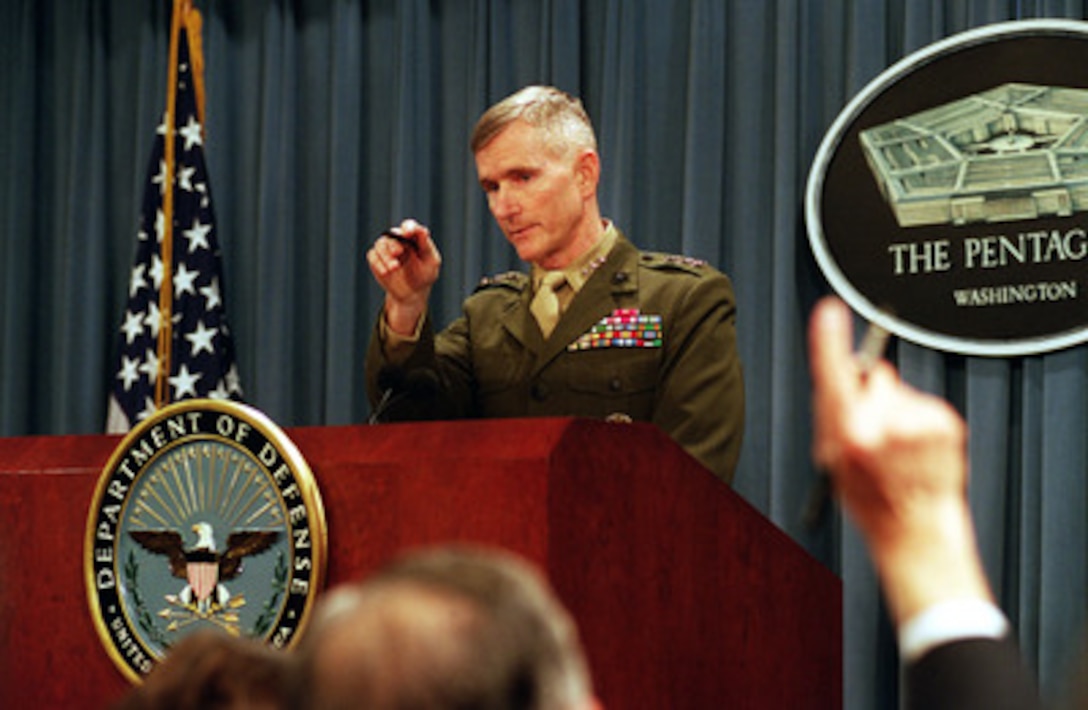 Director of Operations, the Joint Staff, Lt. Gen. Gregory S. Newbold, U.S. Marine Corps, takes questions from reporters at the Pentagon on Feb. 16, 2001, regarding air strikes conducted earlier today by U.S. and British aircraft against Iraq. The attacks against command and control nodes, including radar installations, above the 33rd parallel were ordered in response to recent attempts by Iraq to improve the targeting accuracy of their air defense systems. Twenty-four strike aircraft participated in the raid. 