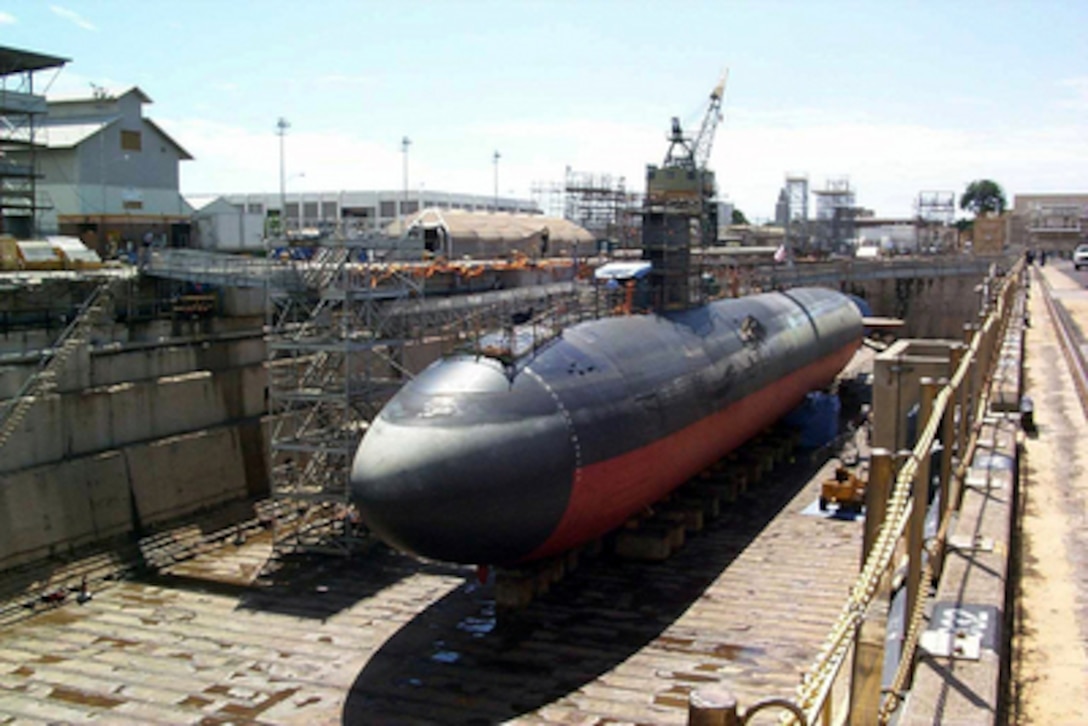 The USS Greeneville (SSN 772) sits atop blocks in Dry Dock #1 at the Pearl Harbor Naval Shipyard and Intermediate Maintenance Facility, Pearl Harbor, Hawaii, on Feb. 21, 2001. The Los Angeles class attack submarine is dry-docked to assess the damage and perform necessary repairs following a Feb. 9 collision at sea with the Japanese fishing vessel Ehime Maru off the coast of Honolulu, Hawaii. 