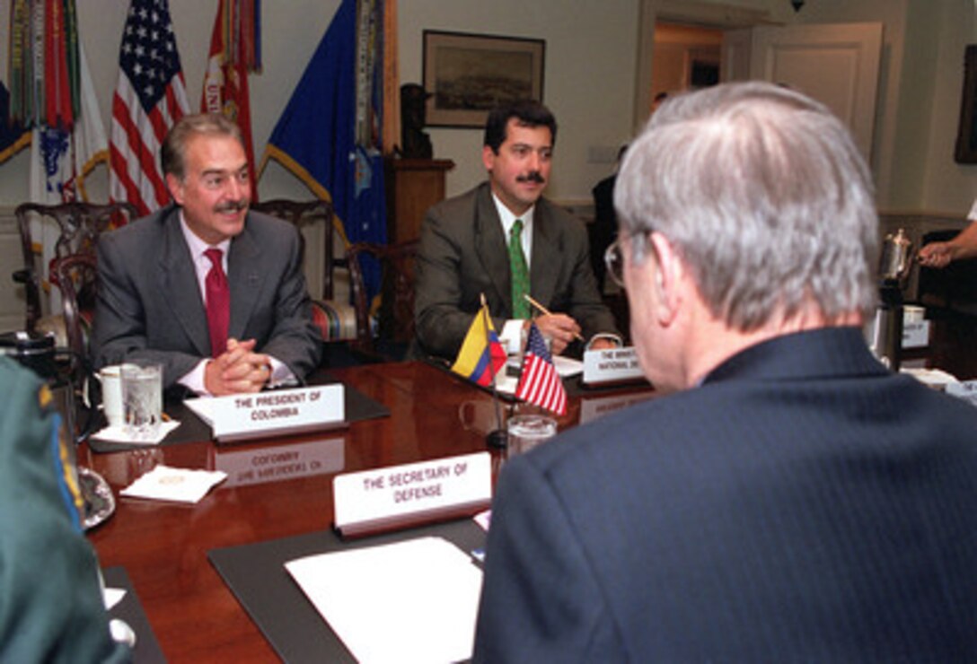 Colombian President Andres Pastrana (left) meets with Secretary of Defense Donald H. Rumsfeld (right) at the Pentagon on Feb. 26, 2001. Pastrana, accompanied by Colombian Minister of National Defense Luis Ramirez (center), is meeting with Rumsfeld to discuss a range of regional issues of interest to both nations. 